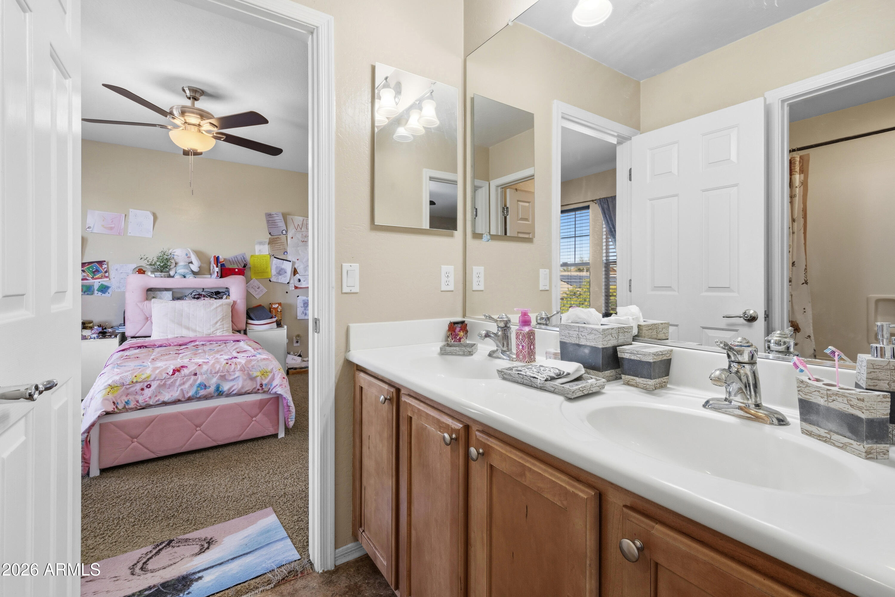 7639 West Georgetown Way Florence, AZ 85132 - Photo 17 of 25 a en suite bathroom with a double vanity sink and a mirror