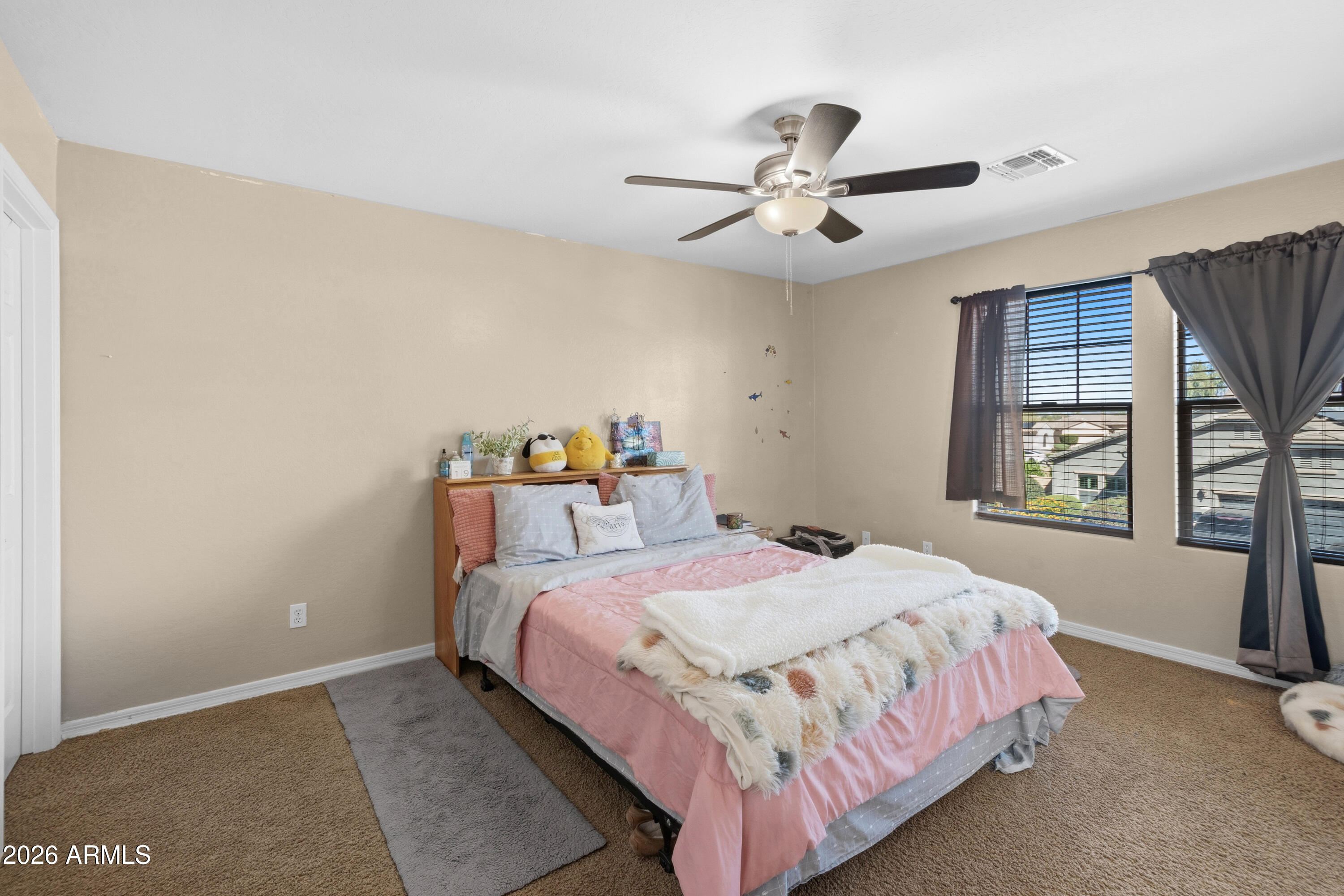 7639 West Georgetown Way Florence, AZ 85132 - Photo 18 of 25 a bedroom with a bed and window