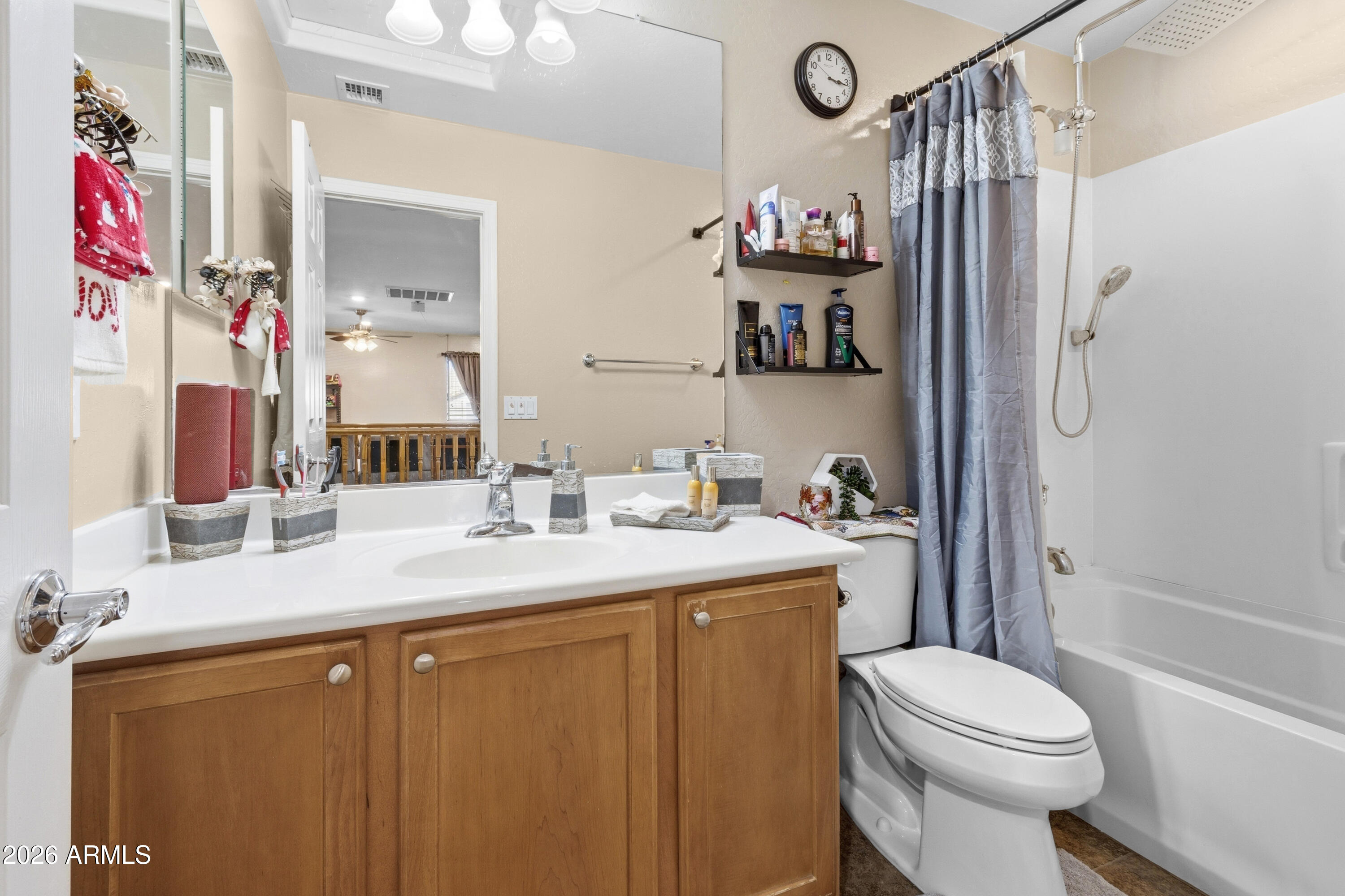 7639 West Georgetown Way Florence, AZ 85132 - Photo 20 of 25 a bathroom with a sink toilet vanity and shower