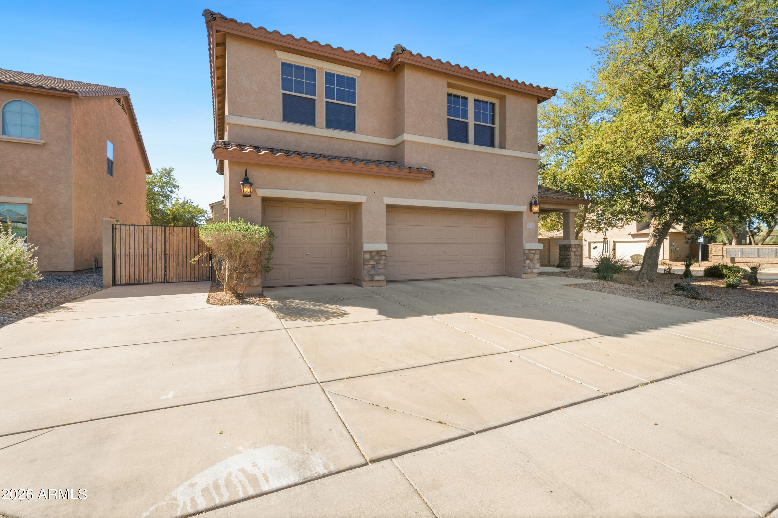 7639 West Georgetown Way Florence, AZ 85132 - Photo 2 of 25 a front view of a house with a yard