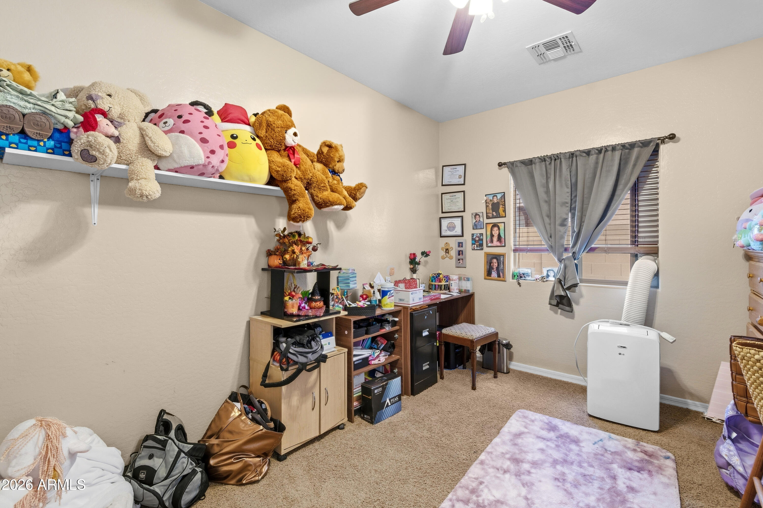 7639 West Georgetown Way Florence, AZ 85132 - Photo 21 of 25 a view of a workspace with furniture and toys