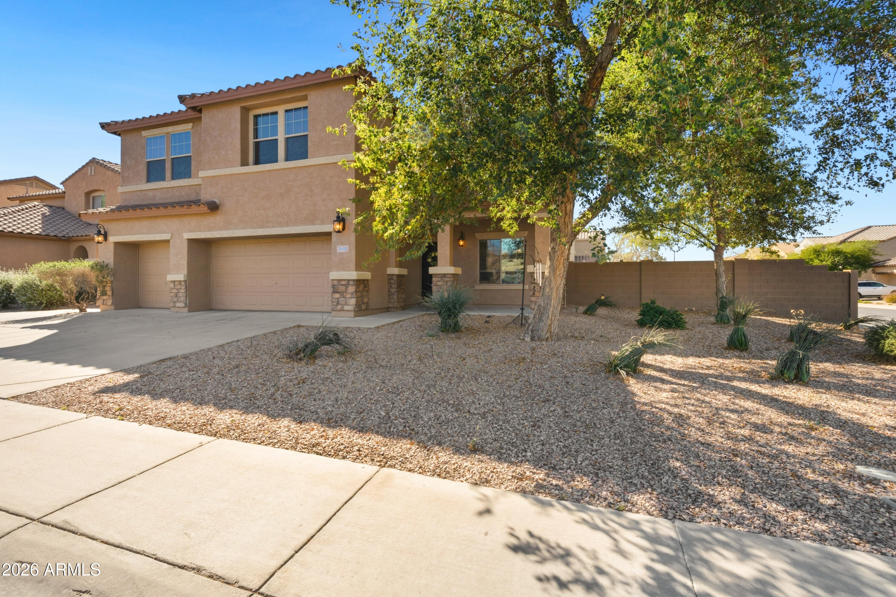 7639 West Georgetown Way Florence, AZ 85132 - Photo 3 of 25 a backyard of a house with table and chairs