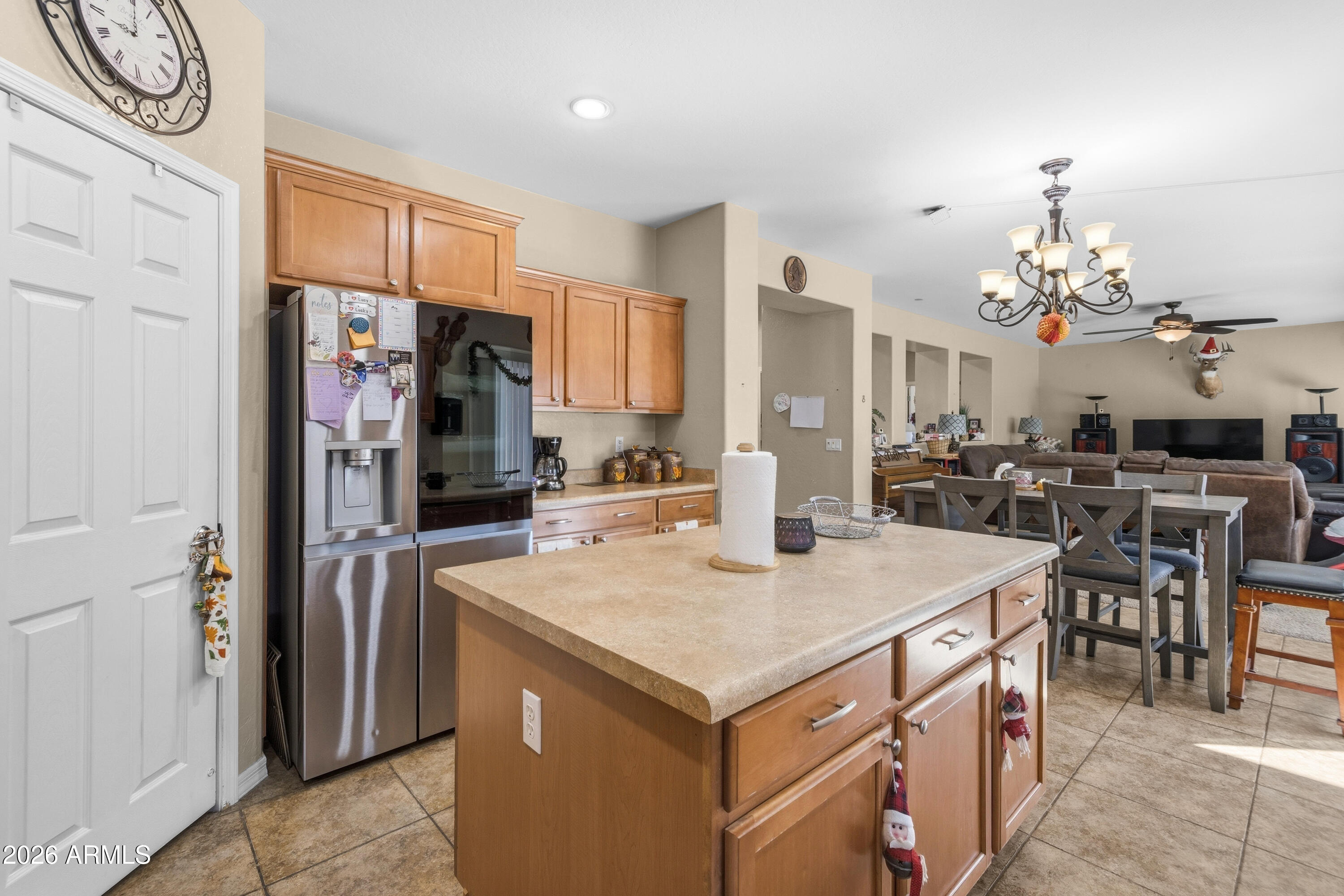 7639 West Georgetown Way Florence, AZ 85132 - Photo 5 of 25 a kitchen that has a lot of cabinets a sink and a refrigerator