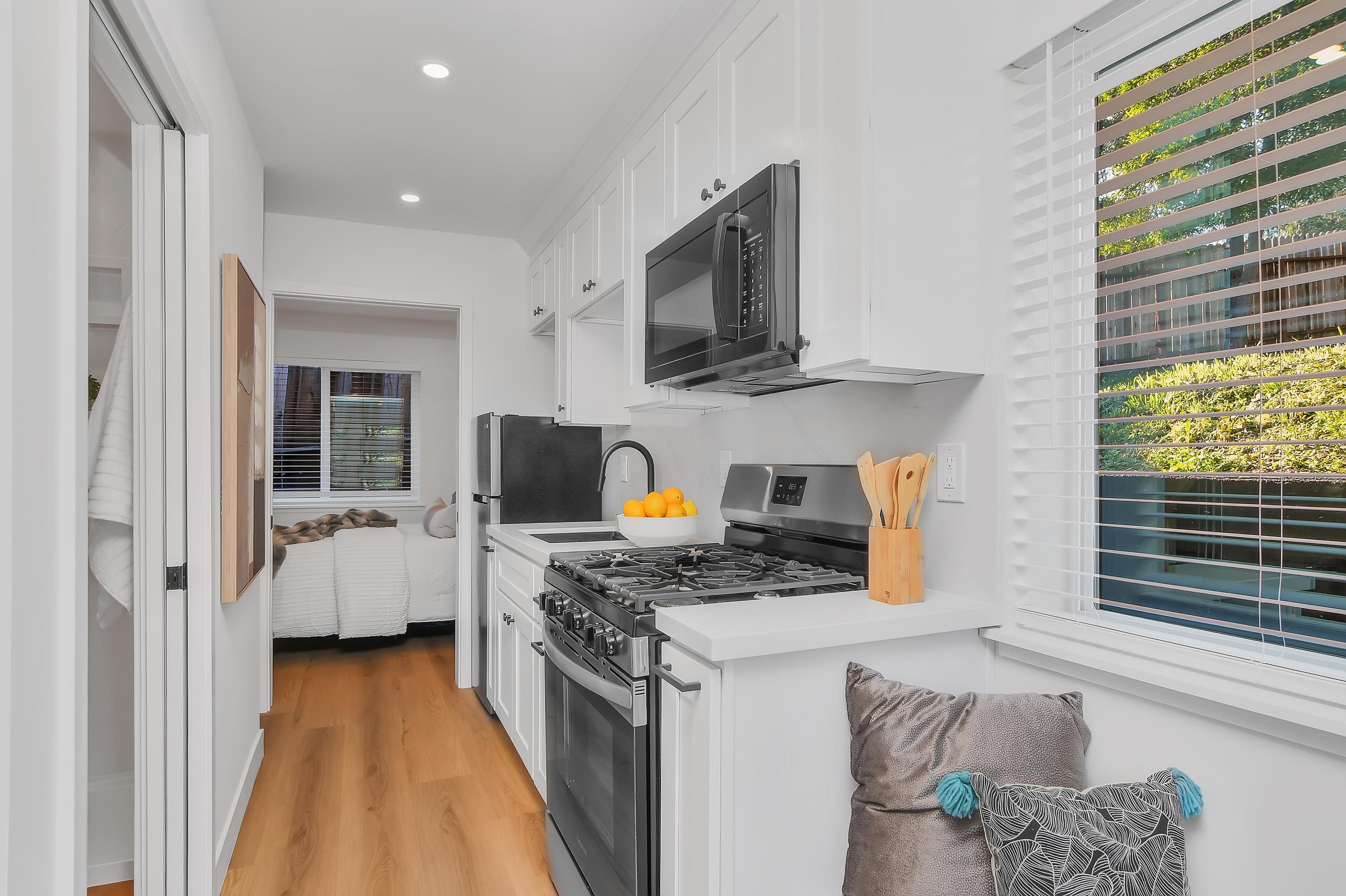 1351 Shell Avenue Martinez, CA 94553 - Photo 21 of 29 Kitchen with white cabinets, appliances with stainless steel finishes, light countertops, light wood-type flooring, and recessed lighting