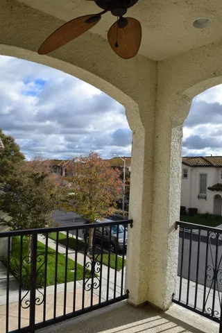a view of balcony with furniture