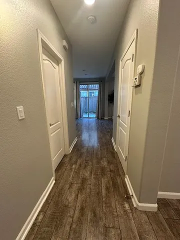 a view of a livingroom from a hallway
