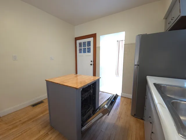 a view of kitchen and wooden floor