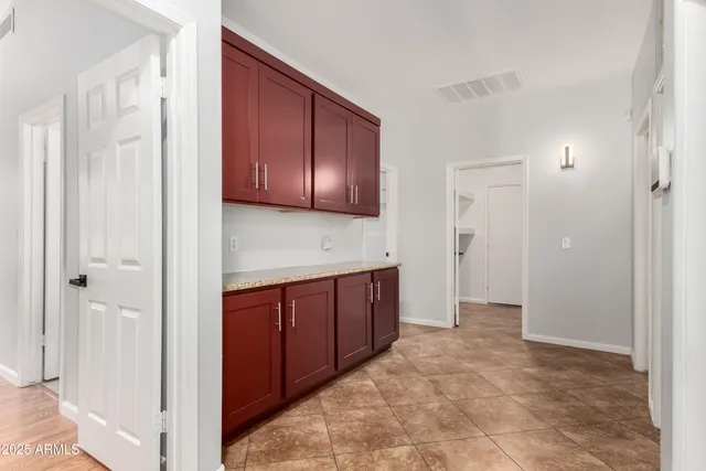 a view of a kitchen with a sink and cabinets