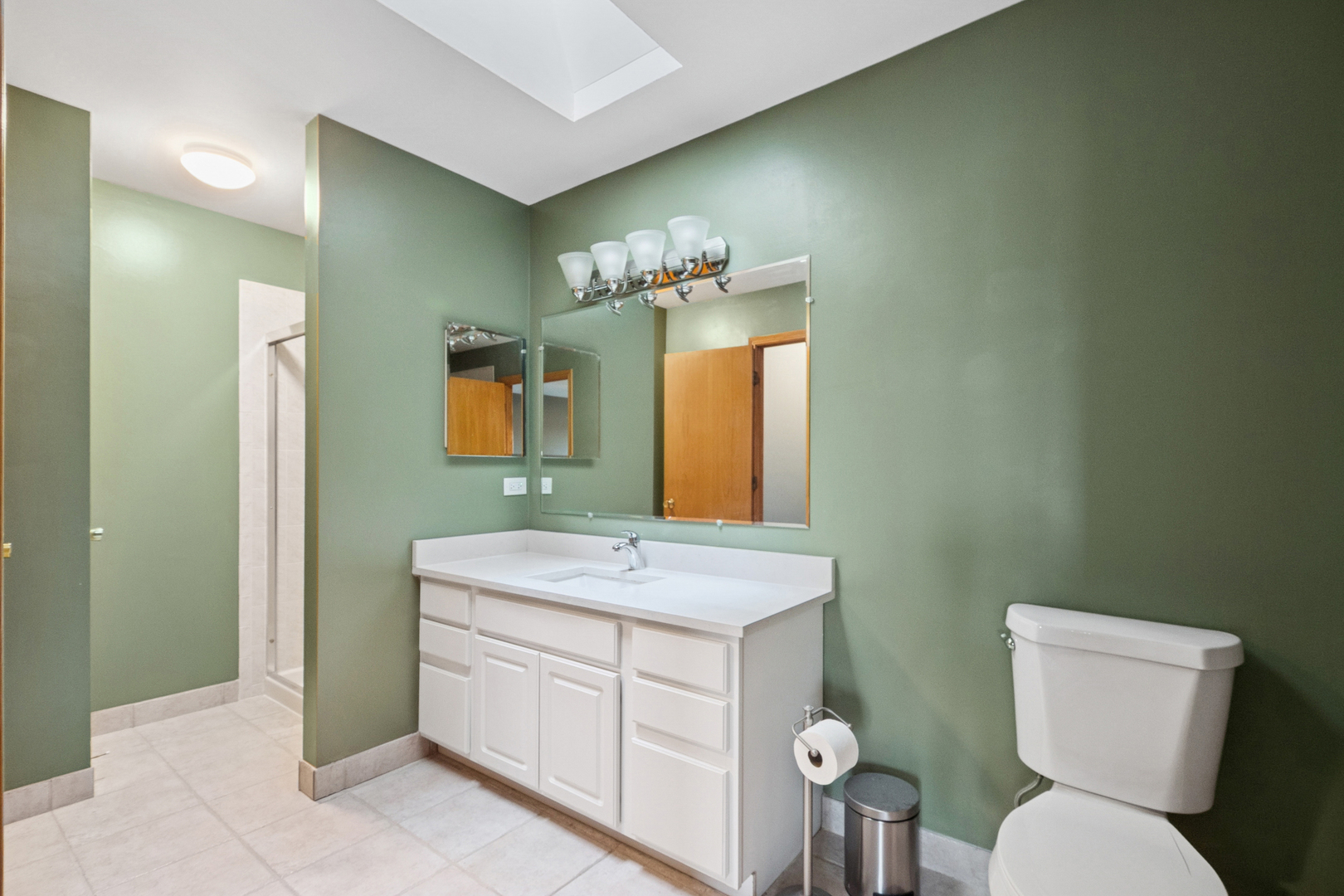 5356 Dixie Drive, Unit 5356 Alsip, IL 60803 - Photo 15 of 20 a bathroom with a toilet sink and mirror