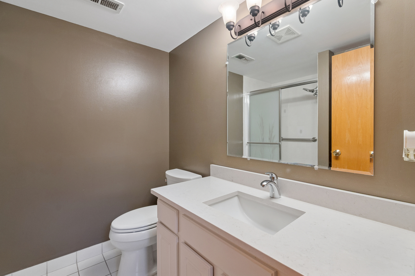 5356 Dixie Drive, Unit 5356 Alsip, IL 60803 - Photo 18 of 20 a bathroom with a sink toilet and mirror