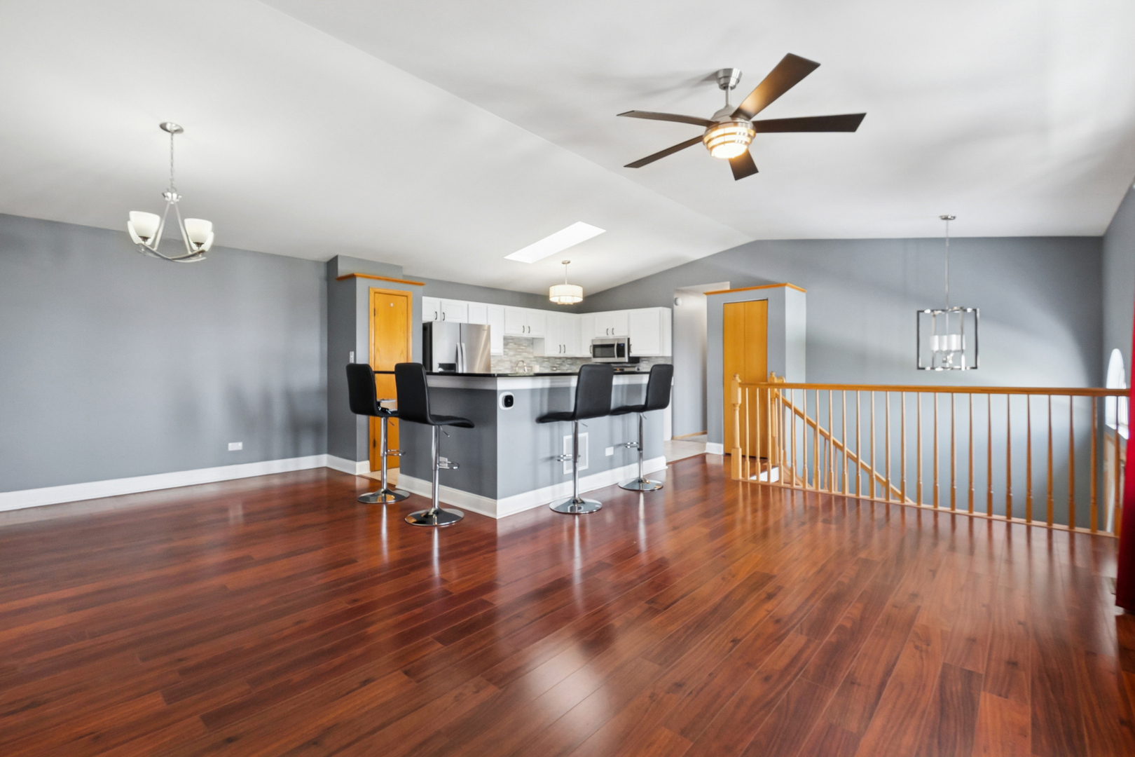 5356 Dixie Drive, Unit 5356 Alsip, IL 60803 - Photo 3 of 20 a view of a room with wooden floor and a ceiling fan