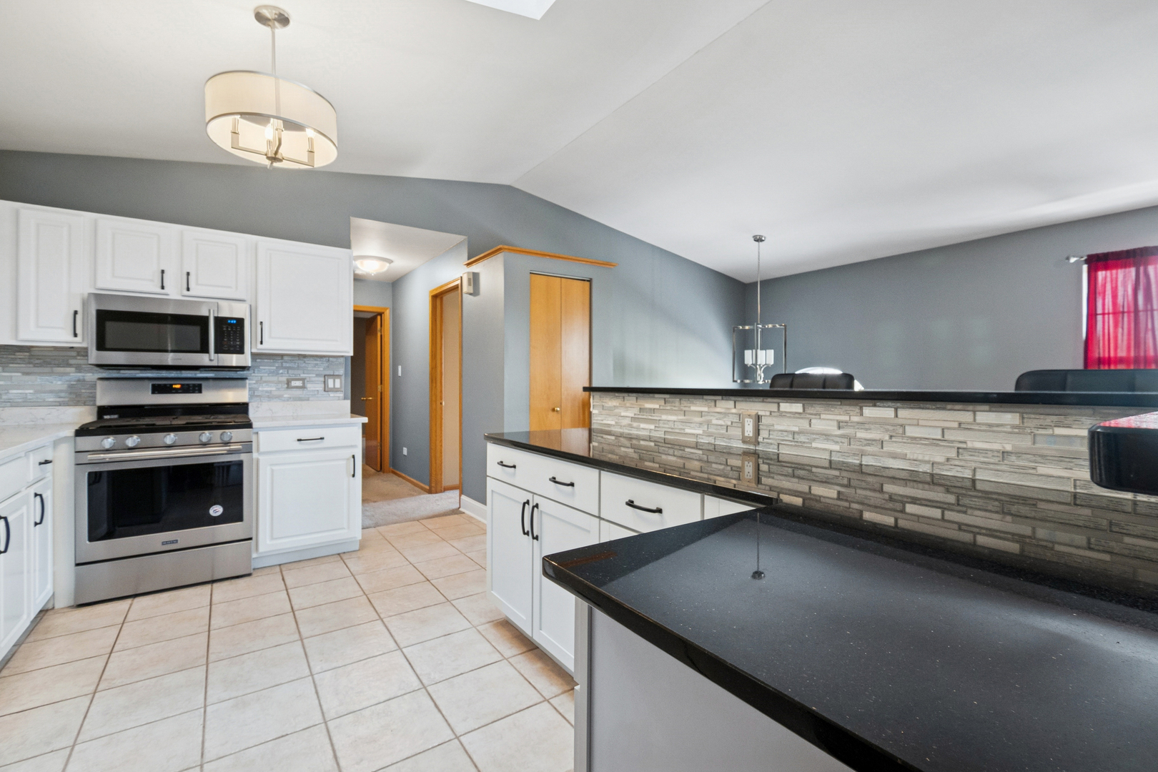 5356 Dixie Drive, Unit 5356 Alsip, IL 60803 - Photo 7 of 20 a kitchen with stainless steel appliances granite countertop a sink and a stove