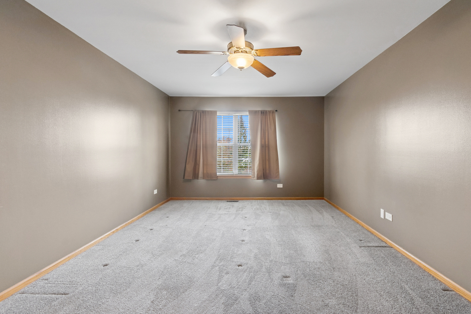 5356 Dixie Drive, Unit 5356 Alsip, IL 60803 - Photo 10 of 20 an empty room with windows and fan