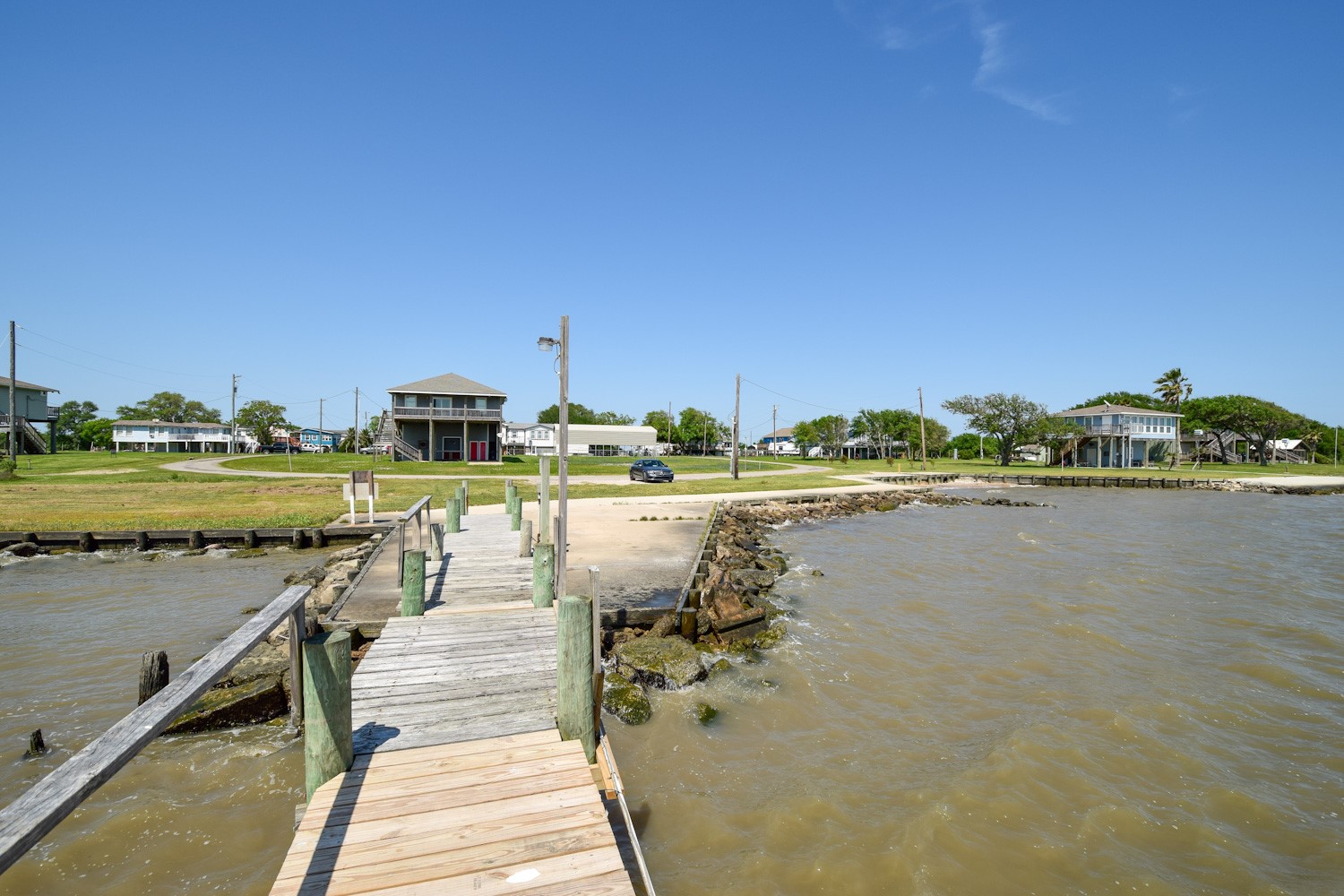 0 James Street Anahuac, TX 77514 - Photo 26 of 35 a view of a lake with a table and chairs