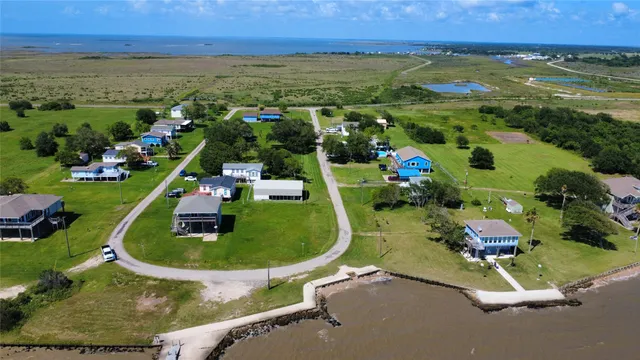 an aerial view of a house with outdoor space