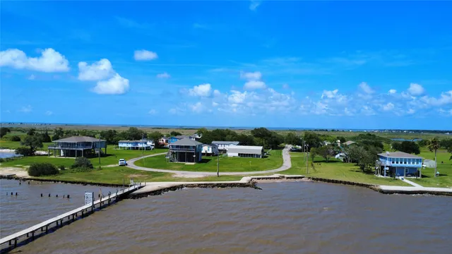 an aerial view of a house with outdoor space