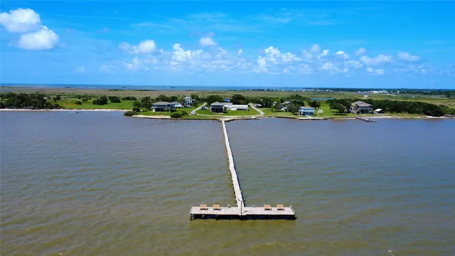 a view of a backyard with seating area and furniture