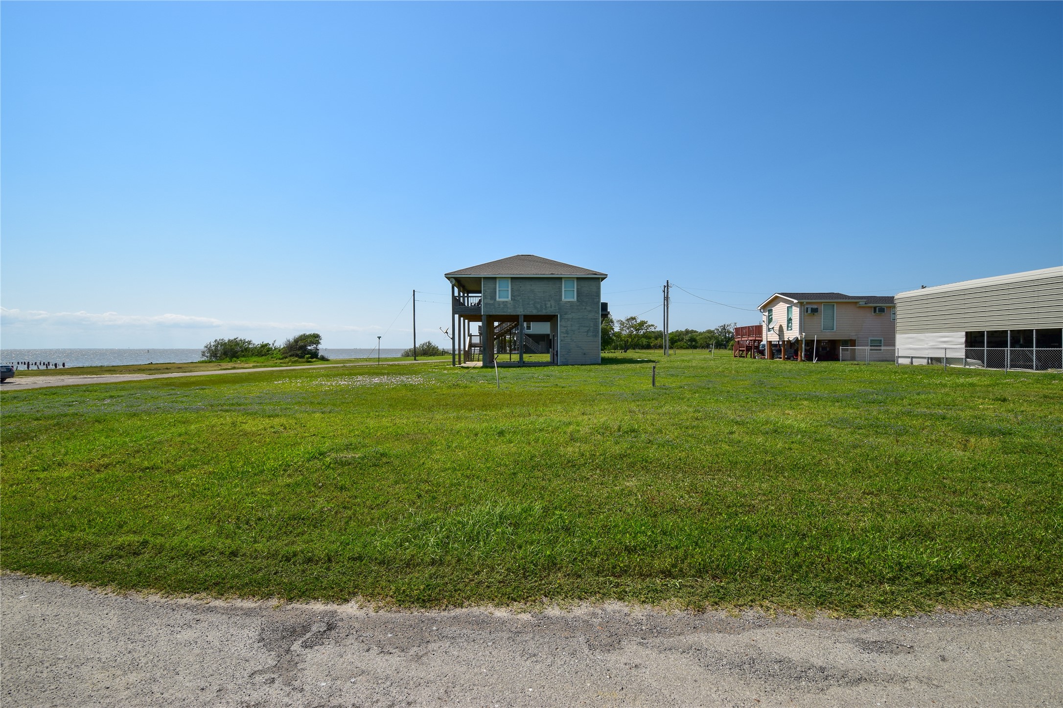 0 James Street Anahuac, TX 77514 - Photo 9 of 35 a backyard of a house with table and chairs