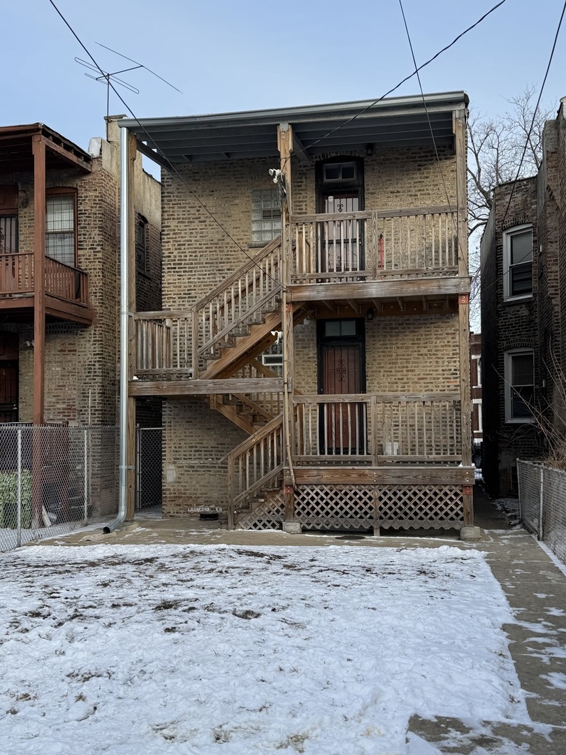6840 South Champlain Avenue, Unit 2 Chicago, IL 60637 - Photo 12 of 12 a front view of a house with a yard