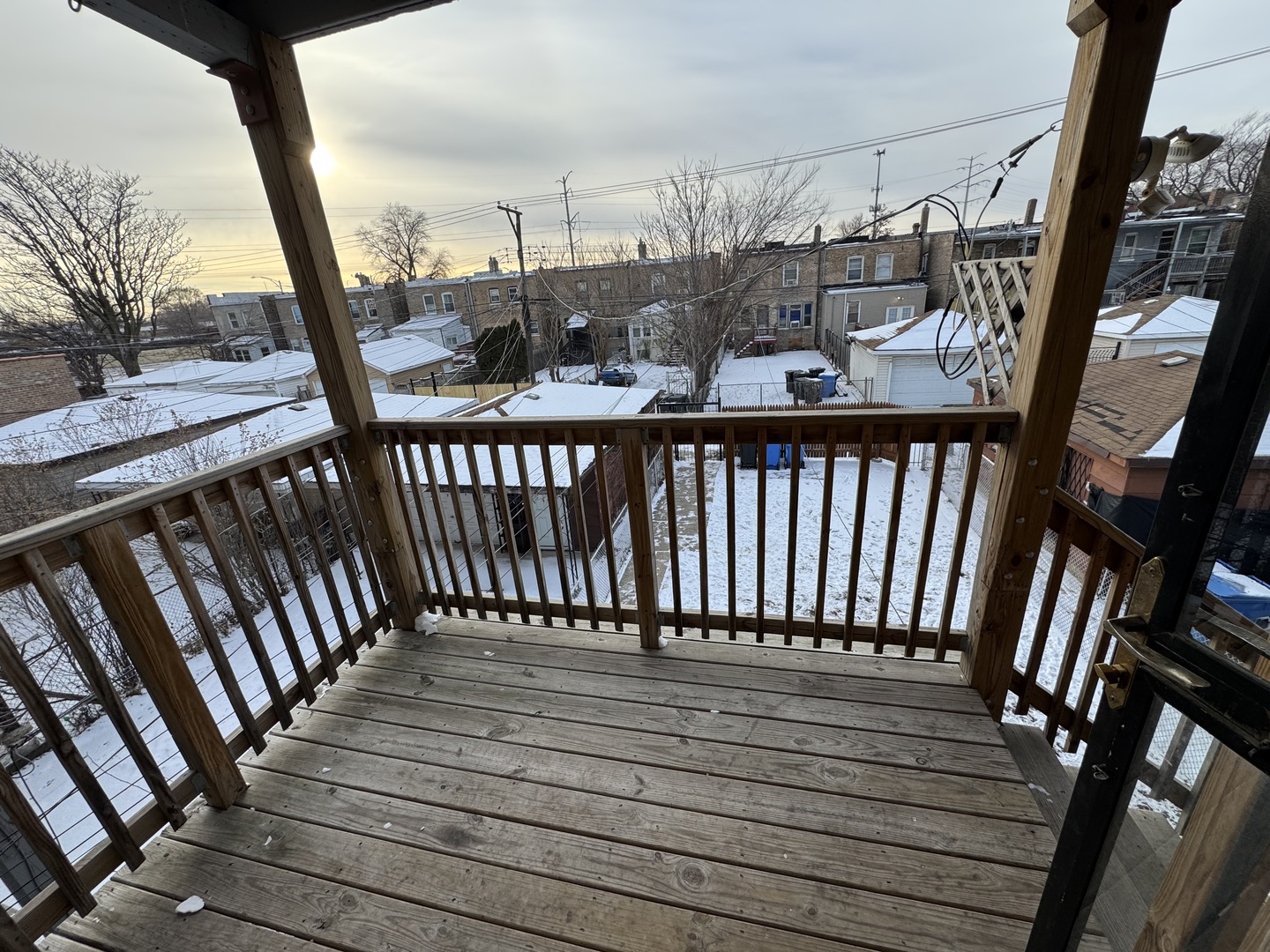6840 South Champlain Avenue, Unit 2 Chicago, IL 60637 - Photo 10 of 12 a view of a balcony with wooden floor