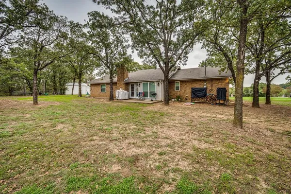 a house with trees in front of it