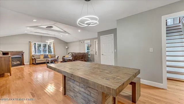 a kitchen with white cabinets sink and appliances