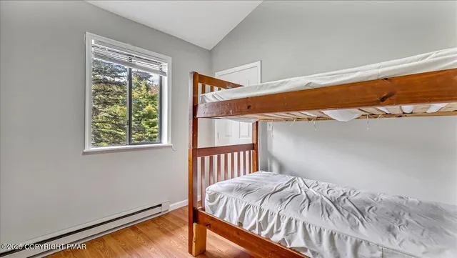 a bedroom with a bed and a lamp