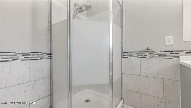 a view of a house with a yard and wooden fence