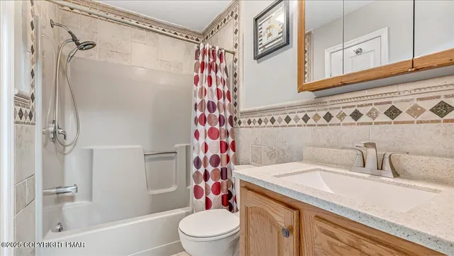 an aerial view of residential house with outdoor space and swimming pool