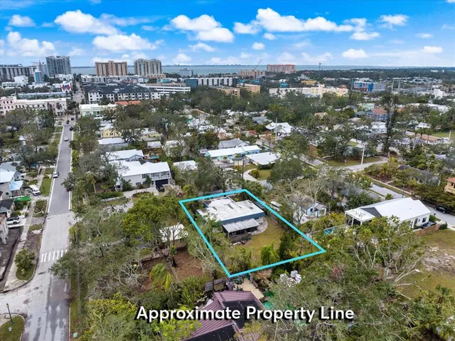 a view of a house with a tree