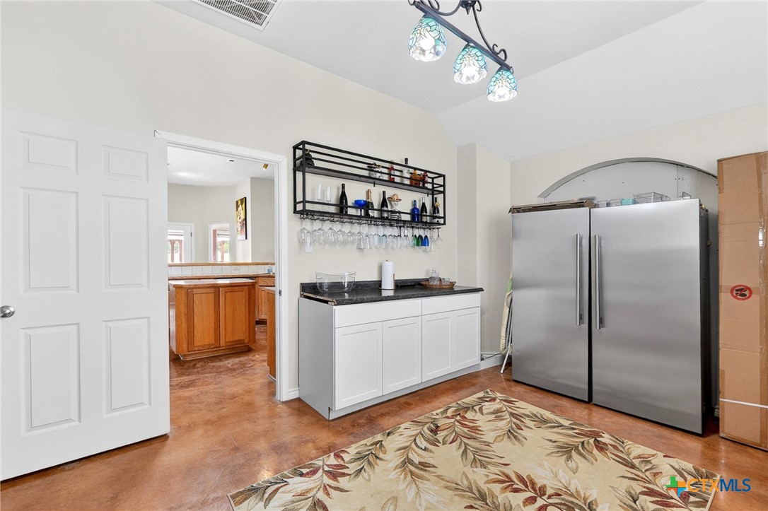 421 Sunset Ridge Drive Killeen, TX 76549 - Photo 21 of 47 a kitchen with stainless steel appliances granite countertop a sink a stove and a refrigerator