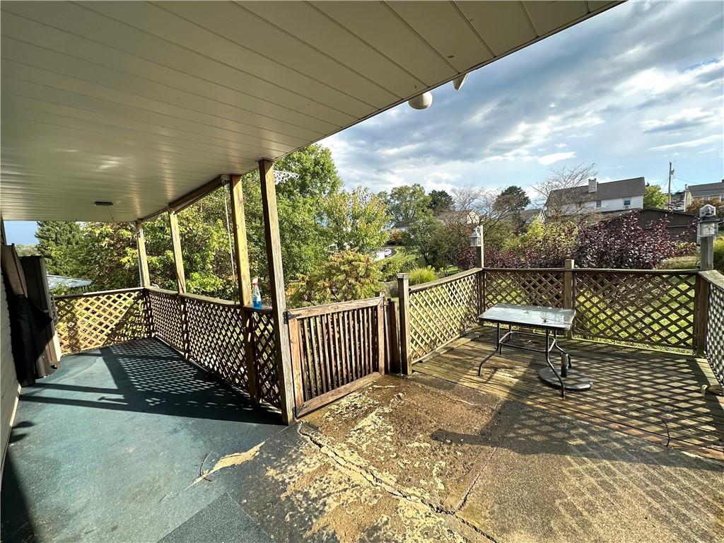 40 2nd Street Lawrence, PA 15055 - Photo 14 of 15 a view of a roof deck with wooden fence and wooden floor