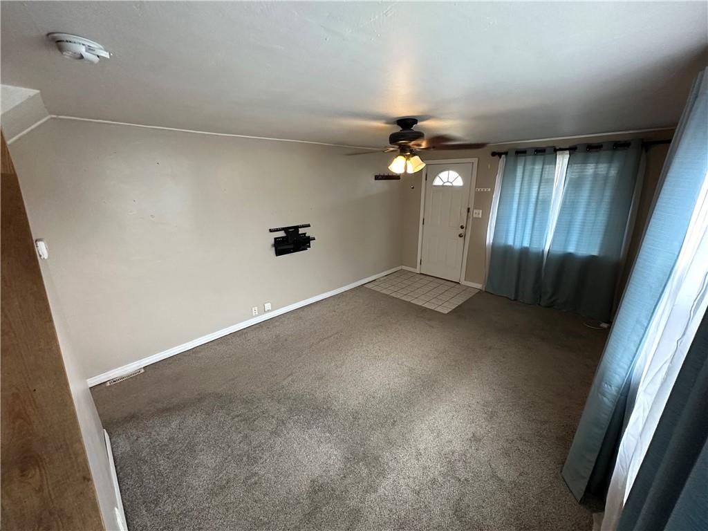 40 2nd Street Lawrence, PA 15055 - Photo 4 of 15 an empty room with a empty space and windows