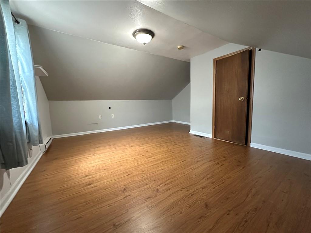 40 2nd Street Lawrence, PA 15055 - Photo 9 of 15 an empty room with wooden floor and windows