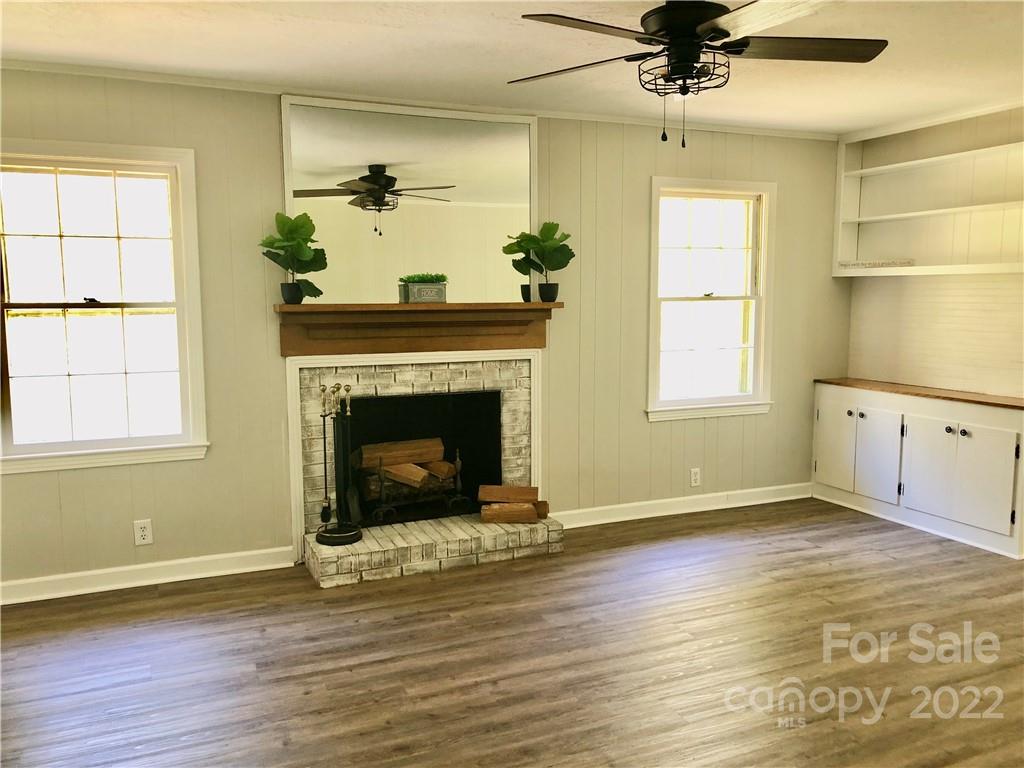 142 Koontz Road Mocksville, NC 27028 - Photo 13 of 47 a view of a livingroom with a fireplace and window