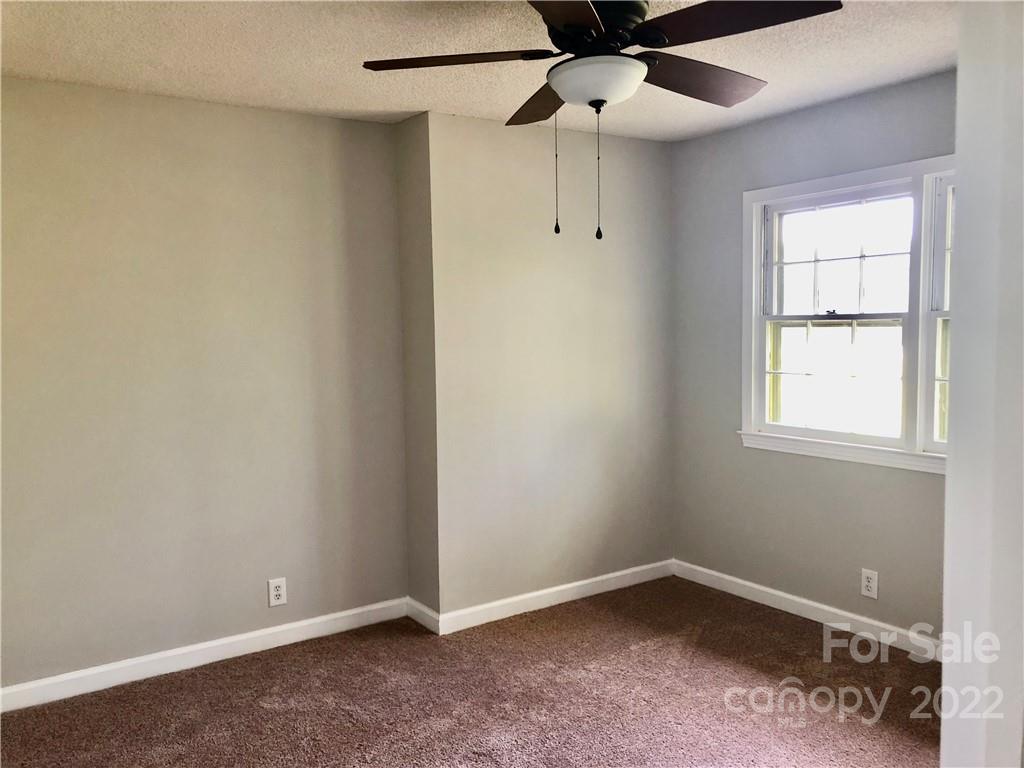 142 Koontz Road Mocksville, NC 27028 - Photo 17 of 47 an empty room with a window and a fan