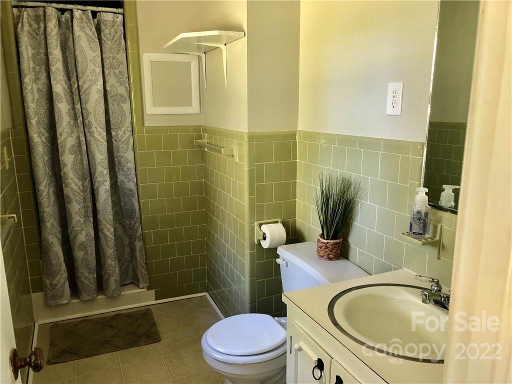 142 Koontz Road Mocksville, NC 27028 - Photo 18 of 47 a bathroom with a sink a toilet and shower