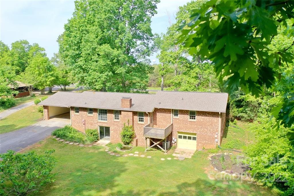 142 Koontz Road Mocksville, NC 27028 - Photo 45 of 47 an aerial view of a house with swimming pool garden and patio