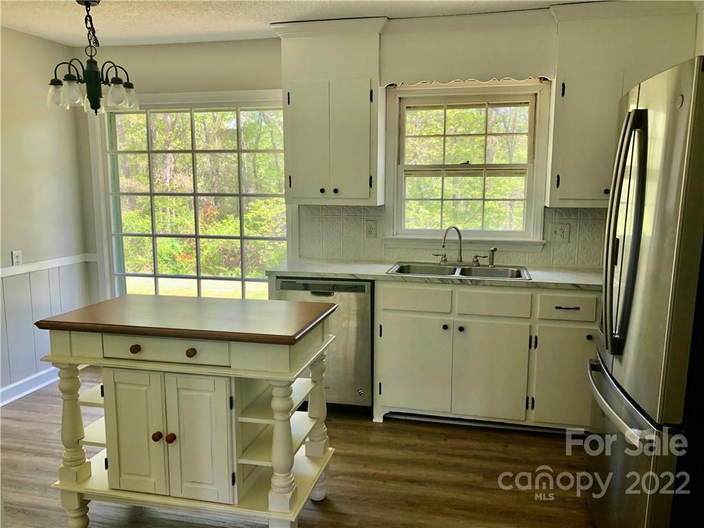 142 Koontz Road Mocksville, NC 27028 - Photo 6 of 47 a view of a kitchen with window and stainless steel appliances