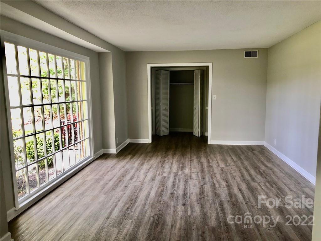 142 Koontz Road Mocksville, NC 27028 - Photo 9 of 47 wooden floor in an empty room with a window