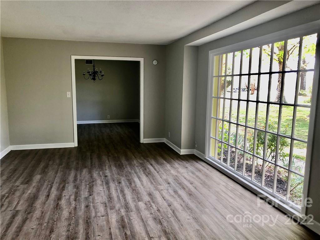 142 Koontz Road Mocksville, NC 27028 - Photo 10 of 47 an empty room with wooden floor and windows