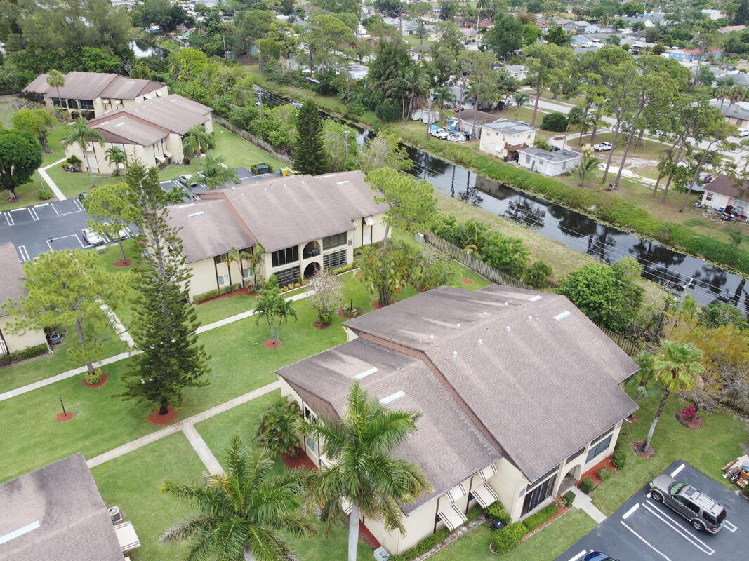 320 Pine Ridge Circle, Unit A1 Greenacres, FL 33463 - Photo 64 of 65 an aerial view of a house with a garden