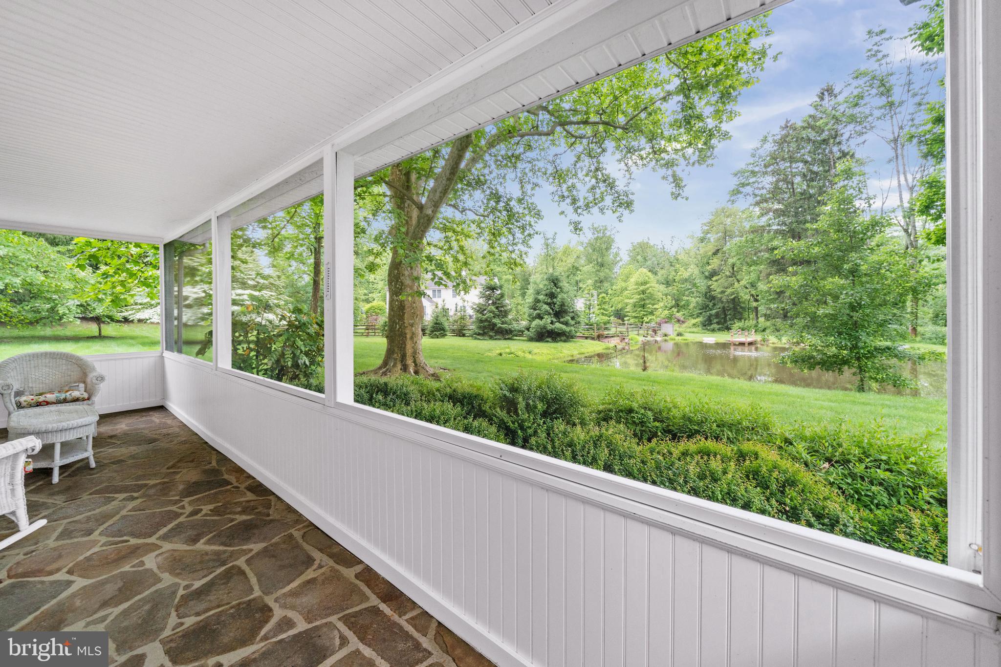 243 Heyburn Road Chadds Ford, PA 19317 - Photo 11 of 58 View of the Yard and Pond from Screened Porch