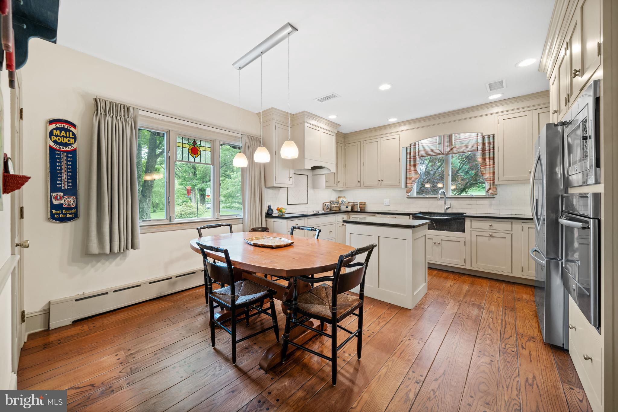 243 Heyburn Road Chadds Ford, PA 19317 - Photo 16 of 58 a view of a dining room with furniture window and wooden floor