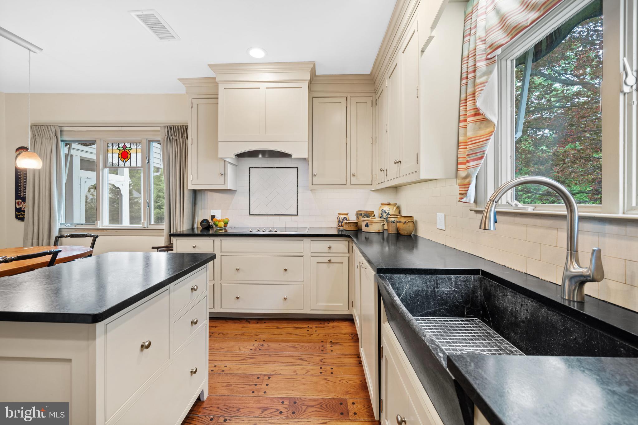 243 Heyburn Road Chadds Ford, PA 19317 - Photo 17 of 58 a kitchen with granite countertop a sink and a stove top oven