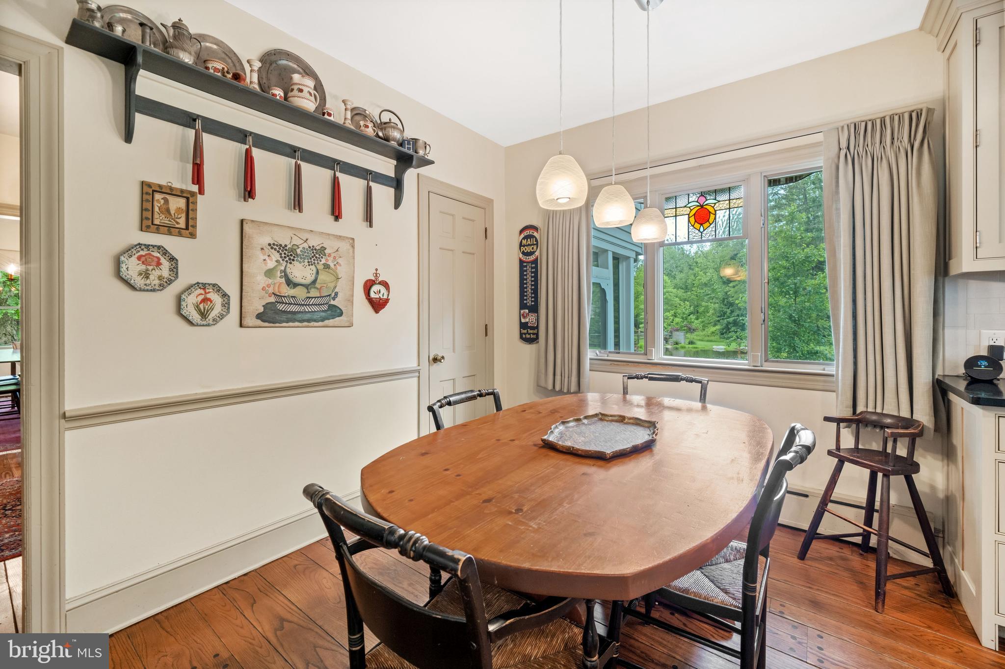 243 Heyburn Road Chadds Ford, PA 19317 - Photo 19 of 58 a view of a dining room with furniture window and wooden floor