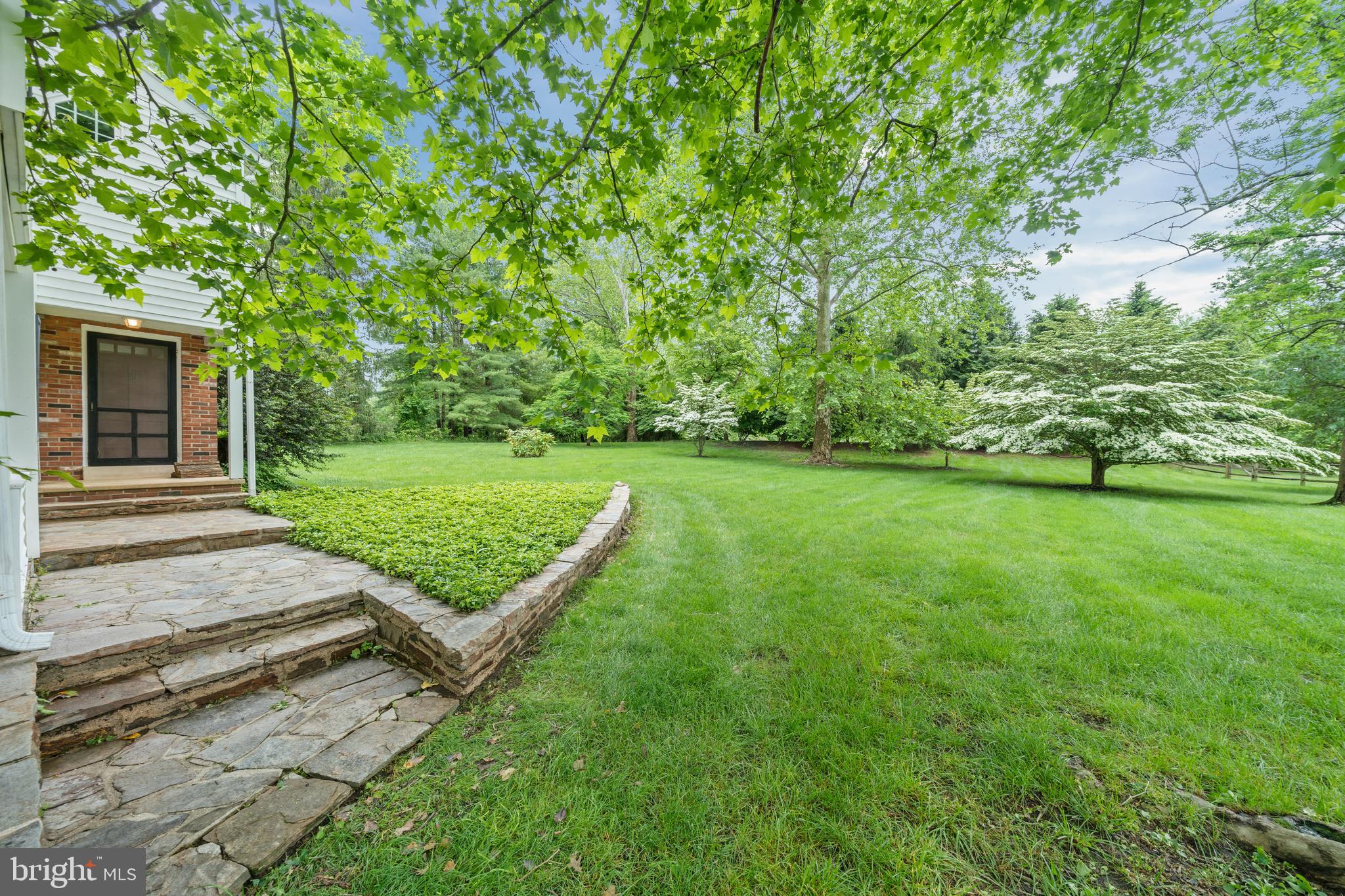 243 Heyburn Road Chadds Ford, PA 19317 - Photo 32 of 58 a view of a backyard with a garden