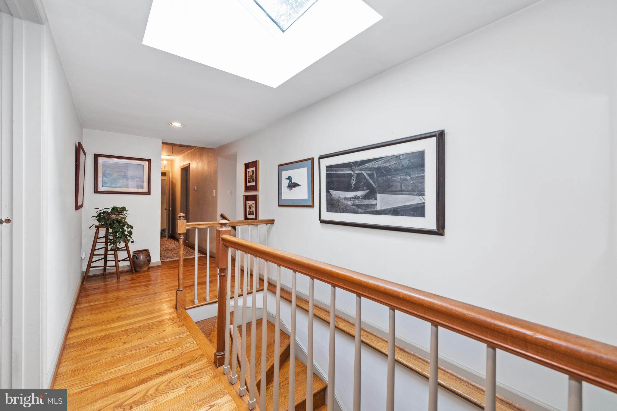 243 Heyburn Road Chadds Ford, PA 19317 - Photo 33 of 58 a view of a hallway with wooden floor and dining room