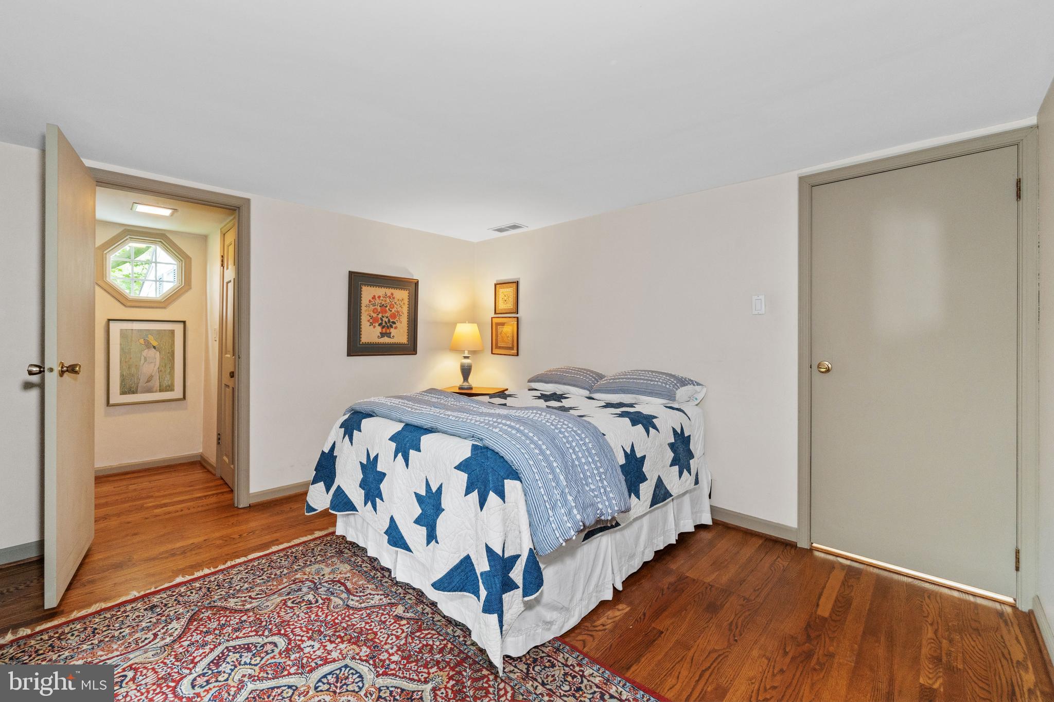 243 Heyburn Road Chadds Ford, PA 19317 - Photo 38 of 58 a bedroom with a bed and wooden floor