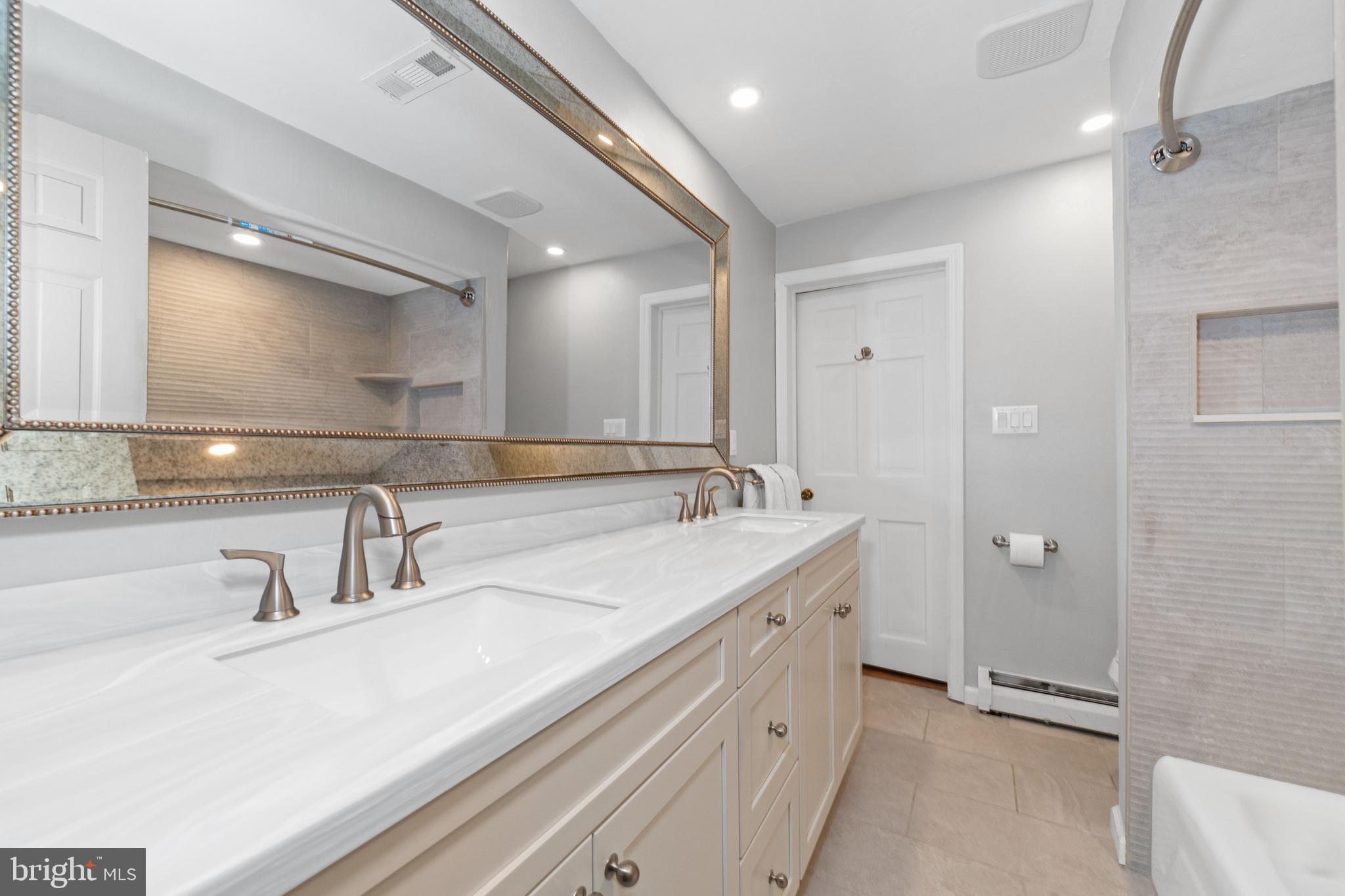 243 Heyburn Road Chadds Ford, PA 19317 - Photo 39 of 58 a bathroom with a double vanity sink mirror and double
